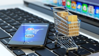 Smartphone, Laptop und Einkaufswagen als Synonyme für mobile Beschaffungsprozesse